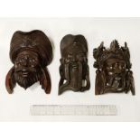 THREE CARVED WOOD MASKS