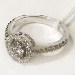 18 CT. WHITE GOLD DIAMOND SOLITAIRE RING WITH HALO CLUSTER TOTAL CENTRE DIAMOND 0.50 CT TOTAL