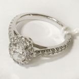 OVAL SHAPED DIAMOND PLATINUM RING CENTRE STONE IS 0.70 CT - TOTAL DIAMOND CONTENT 1.00 CT - SIZE K-