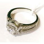 18 CT. WHITE GOLD RING - TOTAL 1.25 CARATS - CENTRE STONE 0.70 CARATS - G COLOUR SI2 CLARITY WITH