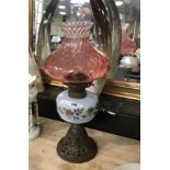 VICTORIAN OIL LAMP WITH CAST IRON BASE - RED SHADE & CHIMNEY - 56 CMS