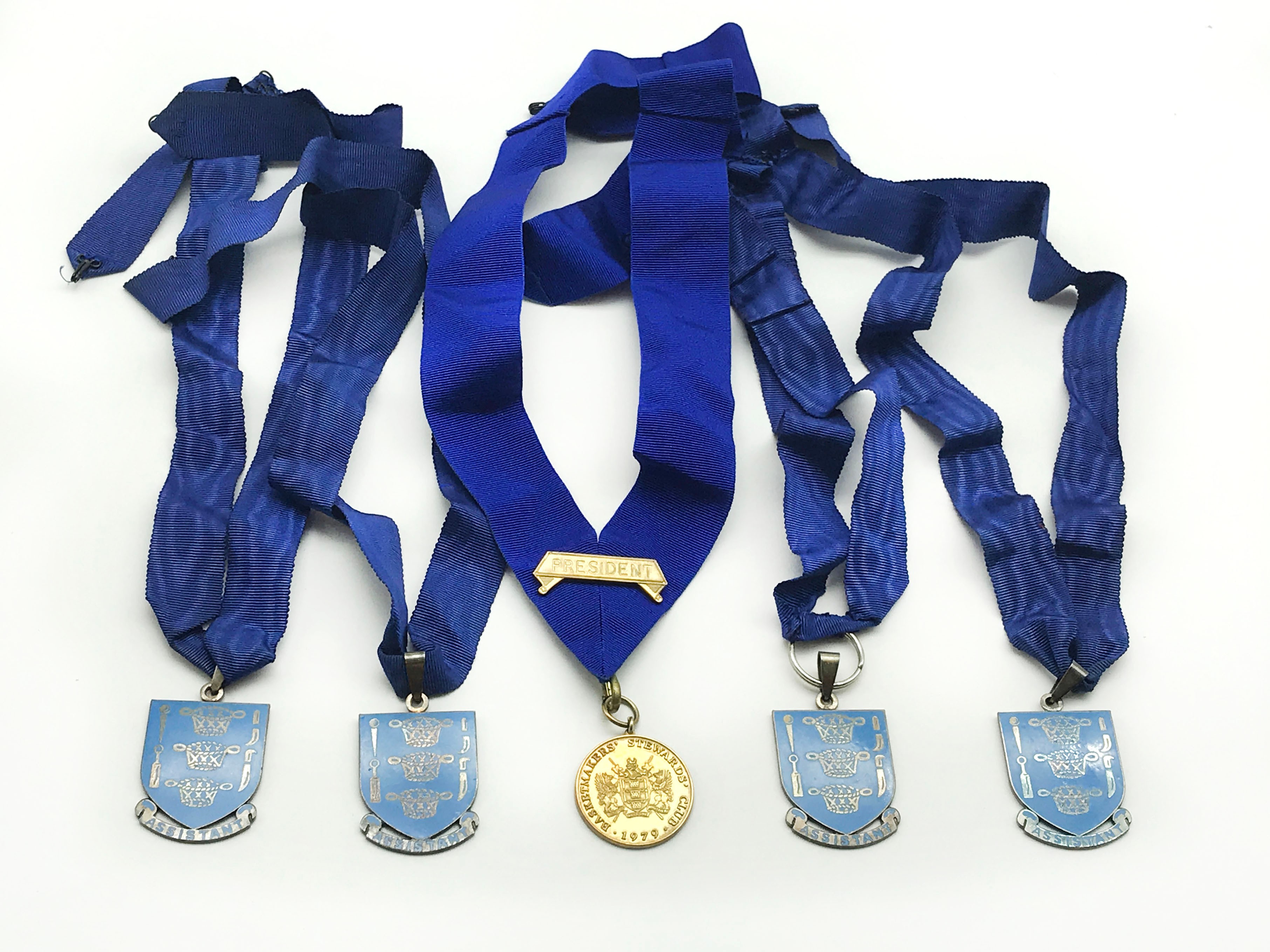 HALLMARKED SILVER BASKETMAKERS STEWARDS CLUB MEDAL AND FOUR METAL JEWELS WITH COLLARS