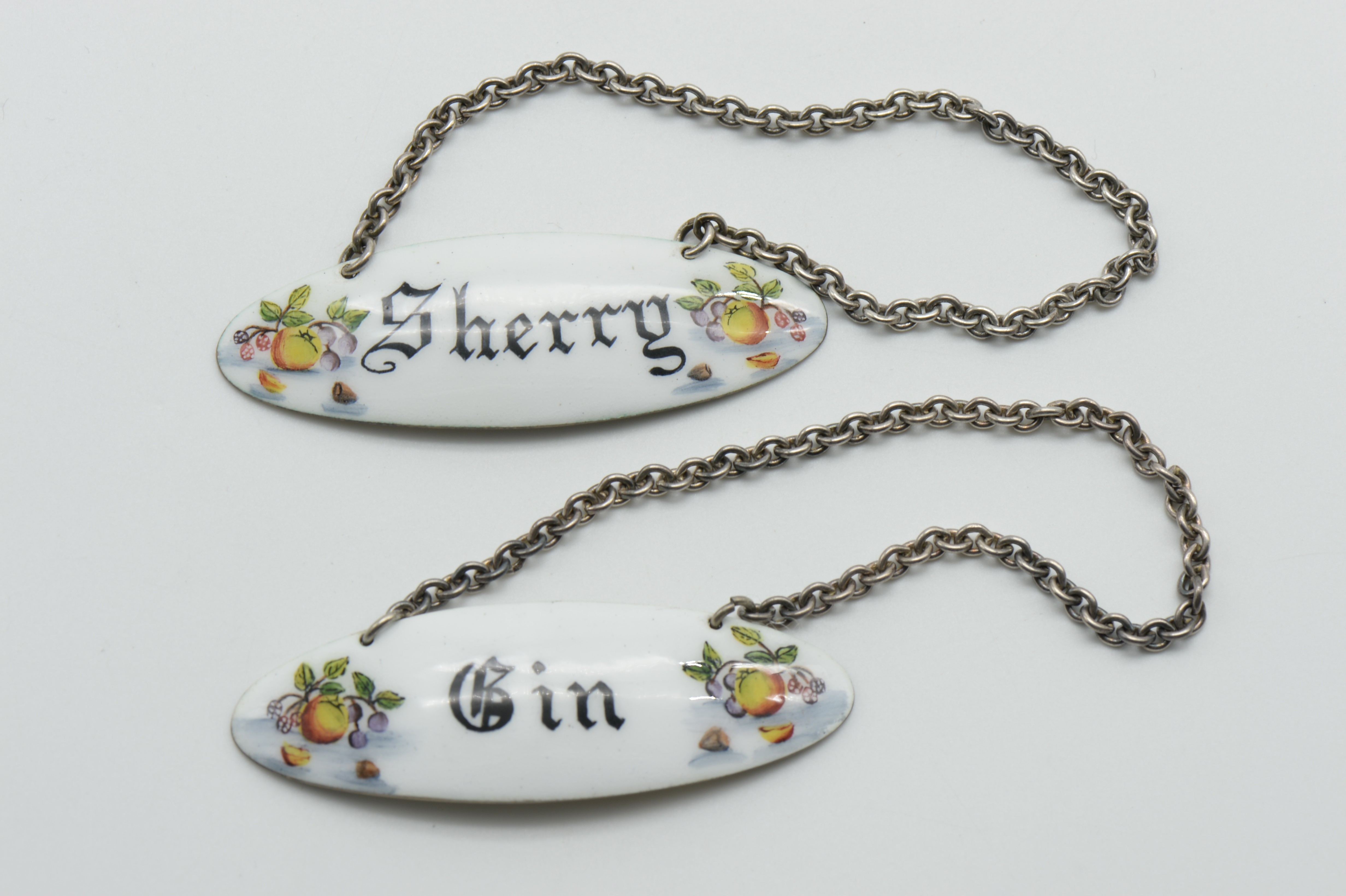 PAIR OF HALLMARKED SILVER AND ENAMEL DECANTER LABELS (SHERRY & GIN)