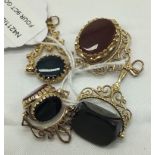 FOUR 9CT GOLD AGATE PENDANTS