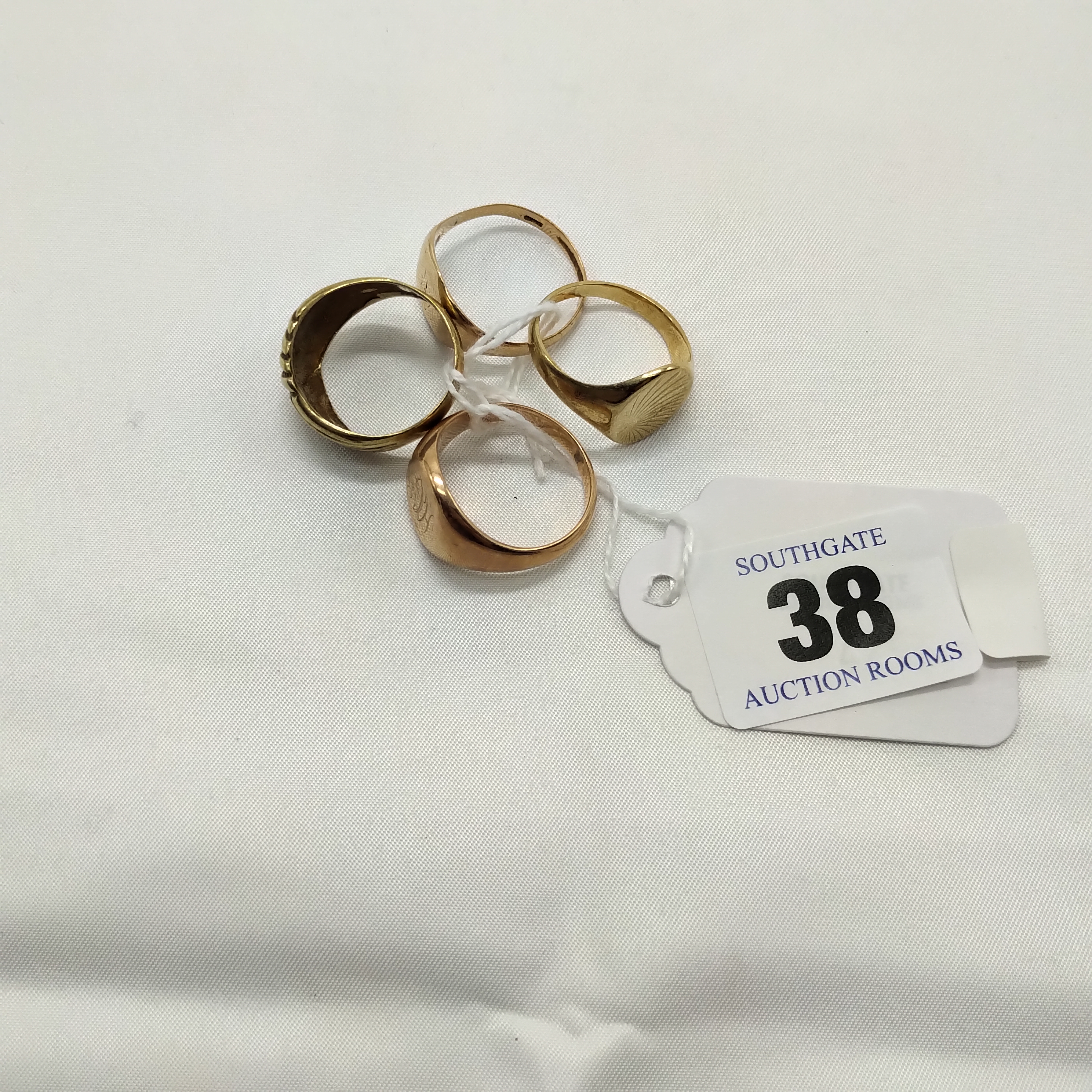 FOUR 9CT GOLD RINGS - 21 GRAMS