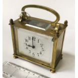 SMALL FRENCH MANTLE CLOCK IN BRASS