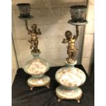 PAIR BRONZE & PORCELAIN CHERUB CANDLE HOLDERS