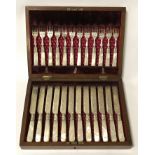 SILVER COLLARED BOXED CUTLERY SET WITH MOTHER OF PEARL HANDLES BY SLATER BROS