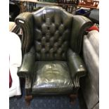 GREEN LEATHER FIRESIDE CHAIR