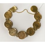 A SEVEN QUARTER SOVEREIGN BRACELET SET IN 22CT GOLD