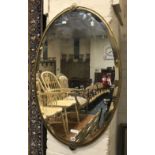 ANTIQUE OVAL BRASS MIRROR