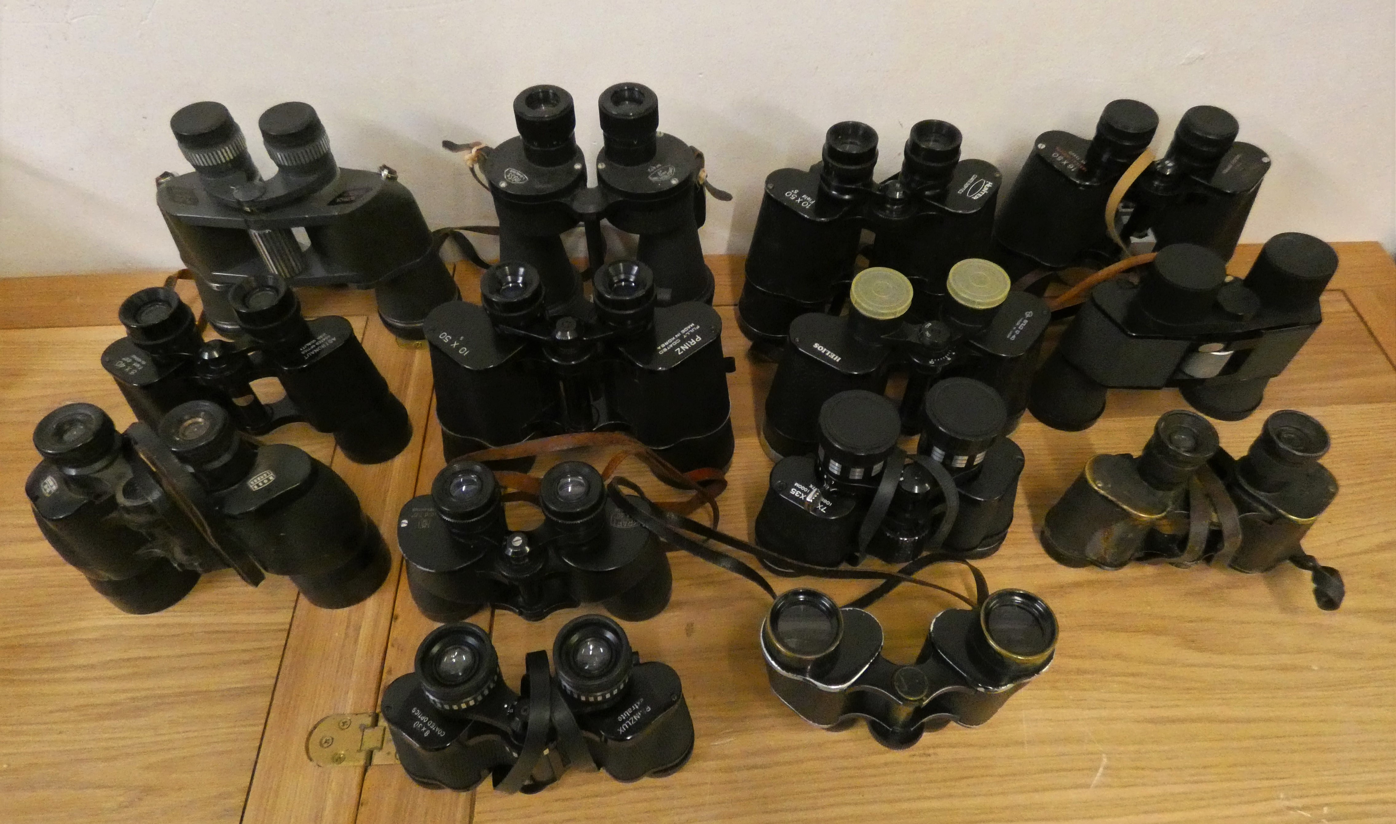 Thirteen pairs of binoculars, mainly cased, to include Ross and Helios-Prinzlux.