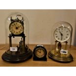 An Edwardian brass Anniversary mantle clock, with dome, a Kundo example and a small circular