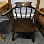 An oak smokers bow armchair.