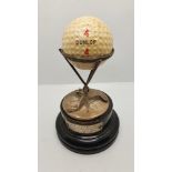 A silver golfing trophy, Birmingham 1927, three twisted clubs supporting a Dunlop 4 ball,
