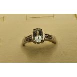 A 9ct white gold aquamarine and diamond ring, one setting vacant, 2 gms, size L 1/2.