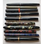 A Palladian mottled fountain pen, a Canadian Parkette mottled fountain pen with 14k nibs and other