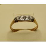 An 18ct gold five stone diamond ring, size R.