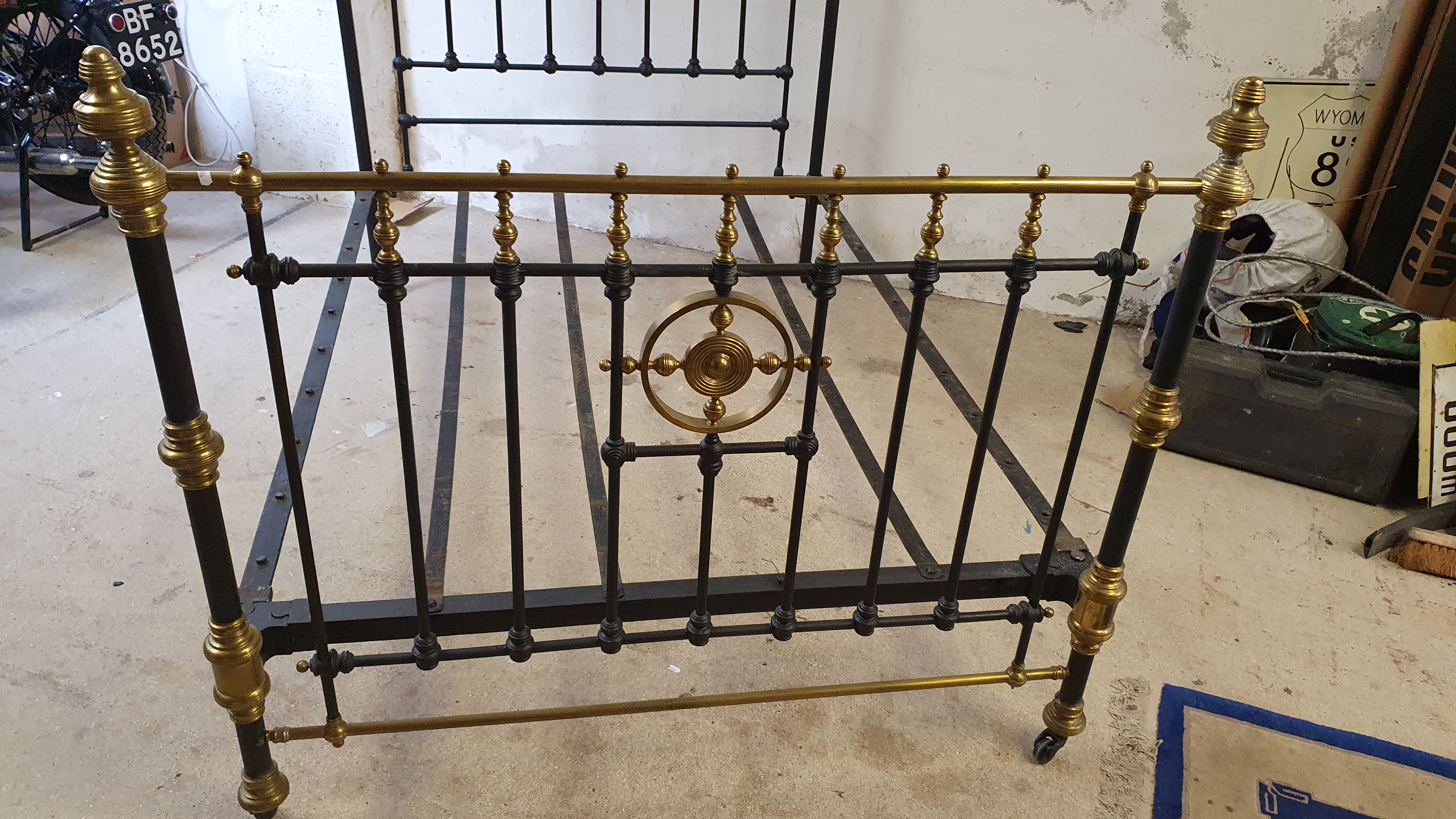 A Victorian cast iron and brass double bed, with castors, one strap missing, 140 cm. - Image 2 of 5