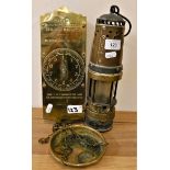 A brass miners lamp and a Salter no. 60 brass improved circular spring balance, to weigh 30 lbs (2).