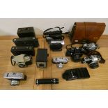 A quantity of SLR camera's, to include Praktica EE2, Pentax MG, Olympus OM10 and two box Brownies.