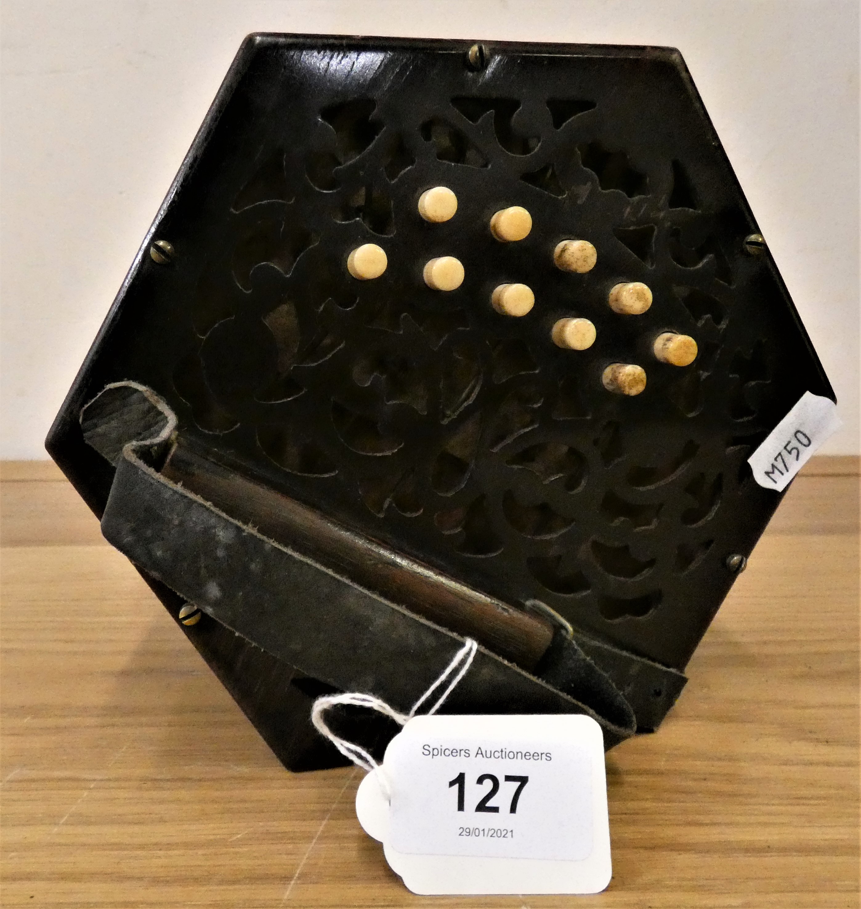 A 21 key concertina, retailed by J. Powell, 16 Ellis Terrace, Holderness Road, Hull.