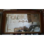 An over mantle mirror marked Cadburys Makers To The King & Queen 85 x 47cm