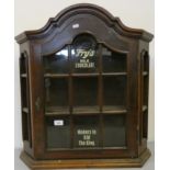 An oak glazed two shelf cabinet, with Frys Milk Chocolate, makers to HM the King painted decal, 67 x