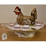 A pottery chicken and egg cup table centre piece, the lift off body to store eggs, bordered by