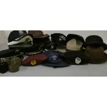 Two Roma Police visor caps, a German State Police visor cap a UAE red beret, a Mounties hat, a