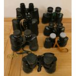 Seven pairs of cased binoculars, to include Migon, Chinon and Ajax.