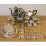 A three piece electroplated tea service, a set of four slats and other plated wares.