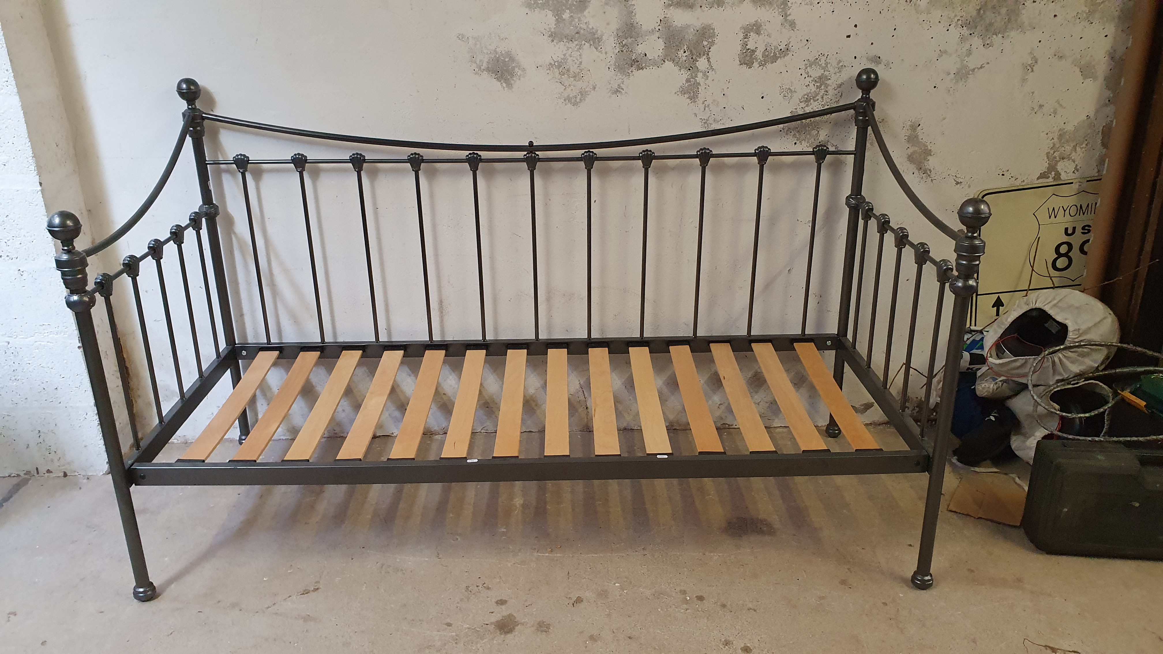 A Laura Ashley grey metal day bed and a white and brass single tester bed, some bolts missing (2).