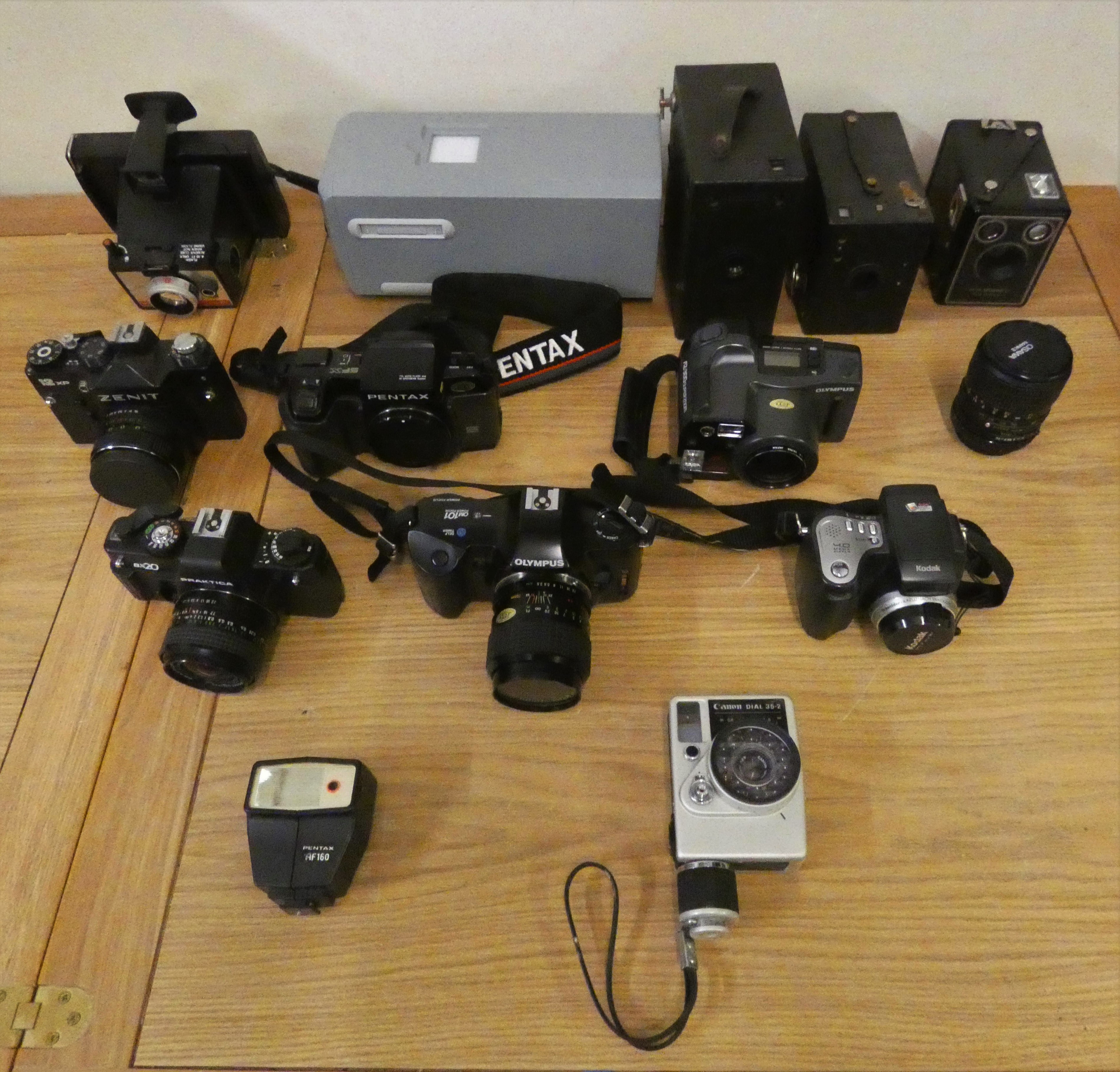 A collection of SLR cameras to include Olympus, Zenit, Chinon and Kodak, together with other