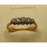An 18ct gold 5 stone diamond ring, set with brilliants, 2.5 gms, size N.