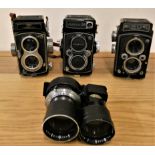 A Yashica 24 camera, a Shanghai camera, a Microcord MPP camera and a Mamiya-Sekor double lens (4).