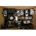 A collection of cameras and cine cameras, to include Nikon F70, Halina-Prefect and Bell & Howell