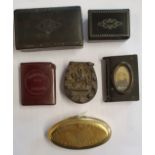 An oval brass snuff box, inscribed Thomas Evans, Taff Well, a vulcanite horseshoe vesta case, two o