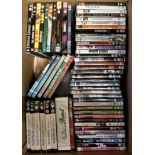 A large collection of DVDs and VHS tapes (2).