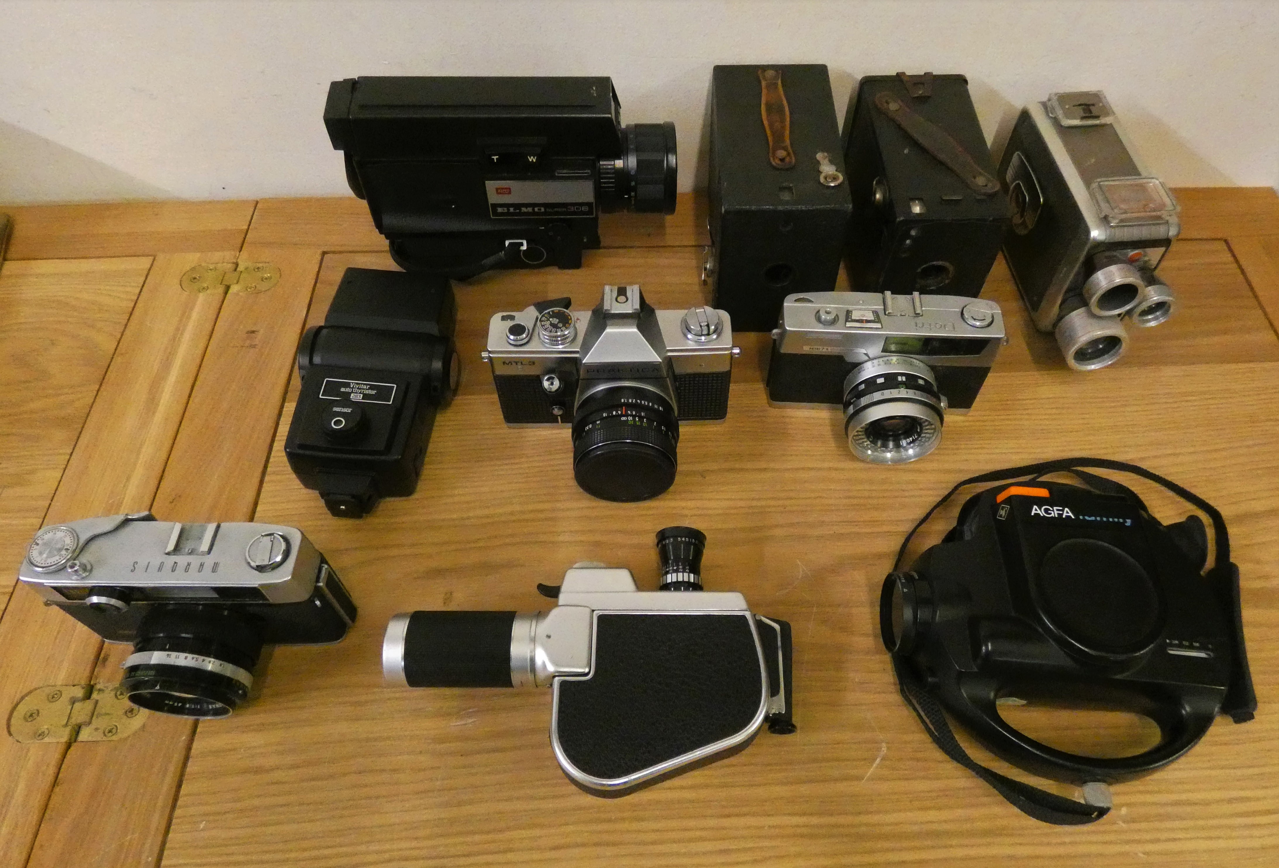 A collection of camera's, to include Praktica, Kodak Hawk Eye, an Elmo Cine camera, in original