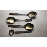 Nils Hansen, a Norwegian silver spoon, two Year spoons and an Egyptian spoon.