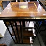 An inlaid mahogany revolving bookcase.