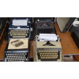 Four typewriters with cases; Silver Reed, two Adler and an Olympia (4).