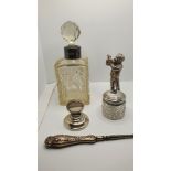 A sterling silver menu holder, a silver mounted glass scent bottle, London 1943 and three other