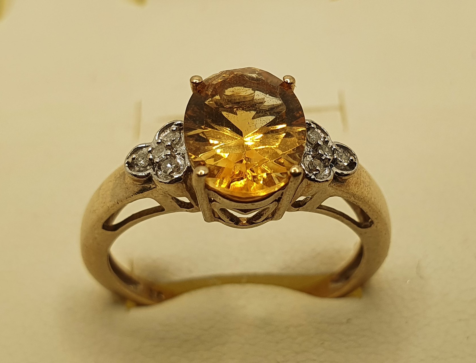 A 9ct gold citrine (chipped) and diamond ring, 2.5 gms, size O1/2.