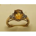 A 9ct gold citrine (chipped) and diamond ring, 2.5 gms, size O1/2.