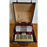A cased Galotta piano accordion.
