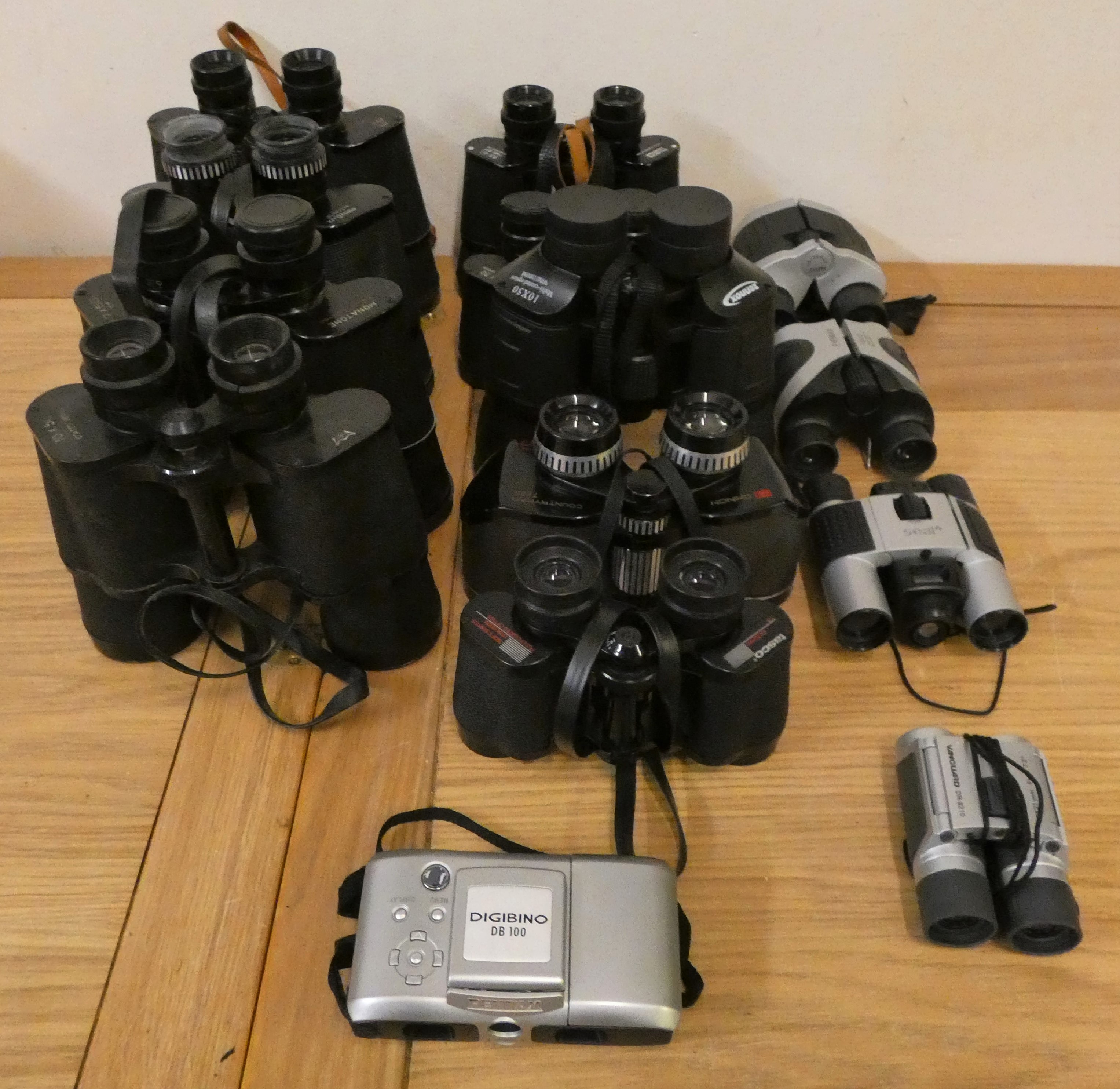 Fouteen pairs of binoculars, cased, to include Pentax, Zennox, Yashica and Comica.