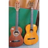 An Hokada acoustic guitar, and a Hondo acoustic guitar. (2)