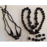 A Whitby Jet carved bead necklace and a French jet double row necklace (2).